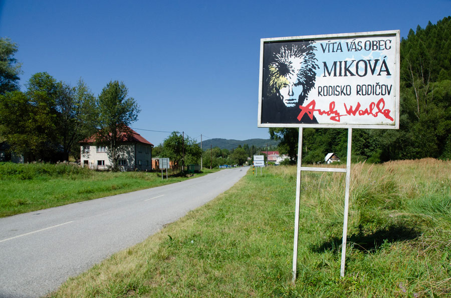 Welcome sign in Mikova with image of Andy Warhol